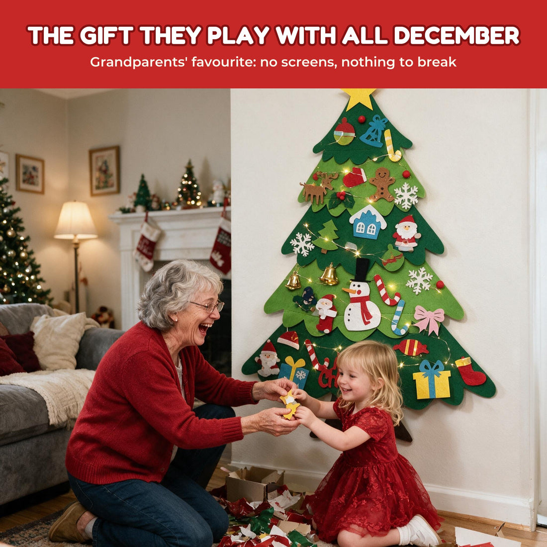 Grandmother and granddaughter decorating the felt Christmas tree together